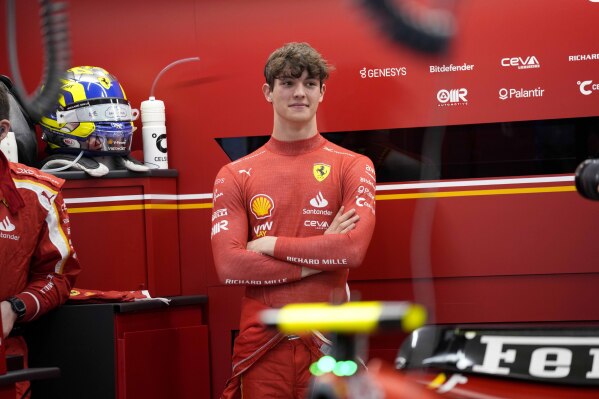 Ferrari driver Oliver Bearman of Britain waits in the Ferrari garage prior to the start of the Formula One Saudi Arabian Grand Prix at the Jeddah Corniche Circuit, in Jedda, Saudi Arabia, Saturday, March 9, 2024. (AP Photo/Darko Bandic)