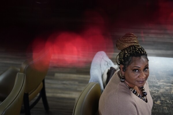 Community activist Carletta Davis poses for a portrait on Wednesday, Dec. 6, 2023, in Prichard, Ala., where 60% of drinking water leaks from the aging distribution system. Communities nationwide are losing trillions of gallons. "It's a heartbreaking situation," said Davis, recounting how residents have been shocked by monthly water bills totaling hundreds or thousands of dollars. (AP Photo/Brynn Anderson)