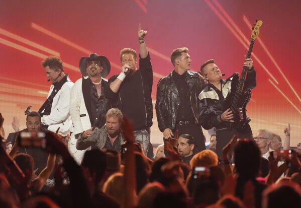 Joe Don Rooney, far left, AJ McLean, Gary LeVox, Nick Carter, and Jay DeMarcus perform during the 60th annual Academy of Country Music Awards on Thursday, May 8, 2025, in Frisco, Texas. (AP Photo/Chris Pizzello)