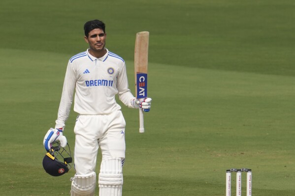 FILE -India's Shubman Gill celebrates his century on the third day of the second test match between India and England, in Visakhapatnam, India, Feb. 4, 2024. (AP Photo/Manish Swarup, File)