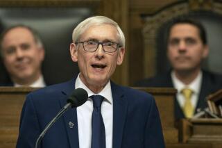 FILE - In this Jan. 22, 2019, file photo, Wisconsin Gov. Tony Evers addresses a joint session of the Legislature in the Assembly chambers during the Governor's State of the State speech at the state Capitol in Madison, Wis. A group formed to support former President Donald Trump's agenda is working with Wisconsin Republicans on a ballot measure that would bypass Evers, the state's Democratic governor, to change how elections are run in the battleground state. (AP Photo/Andy Manis, File)