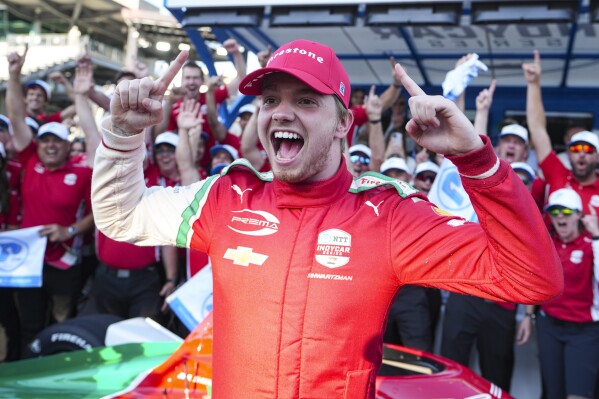Robert Shwartzman, of Israel, celebrates after winning the pole position during qualifications for the Indianapolis 500 auto race at Indianapolis Motor Speedway in Indianapolis, Sunday, May 18, 2025. (AP Photo/Michael Conroy)