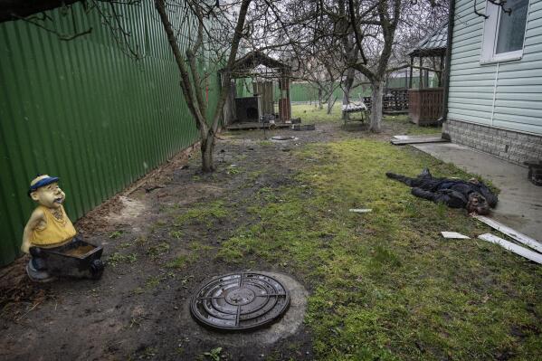 EDS NOTE: GRAPHIC CONTENT - The body of a man lies on the ground days after his death in Bucha, on the outskirts of Kyiv, Ukraine, Monday, April 4, 2022. (AP Photo/Rodrigo Abd)