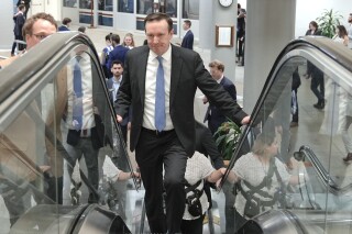 Sen. Chris Murphy, D-Conn., rides an escalator at the Senate subway on Capitol Hill Tuesday, March 12, 2024, in Washington. (AP Photo/Mariam Zuhaib)