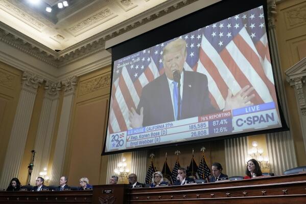FILE - A video of then-President Donald Trump speaking is displayed as the House select committee investigating the Jan. 6 attack on the U.S. Capitol holds a hearing on Capitol Hill in Washington, Thursday, Oct. 13, 2022. In an extraordinary step, the House Jan. 6 committee on Thursday voted to subpoena former President Donald Trump. (AP Photo/J. Scott Applewhite, File)