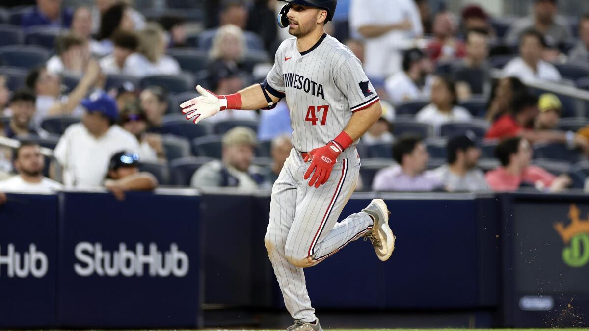 Minnesota Twins' Edouard Julien (47) talks to Carlos Correa against the New  York Yankees during the fifth inning of a baseball game Thursday, April 13,  2023, in New York. (AP Photo/Adam Hunger