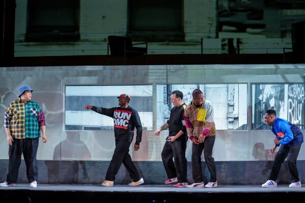In this photo provided by the Detroit Opera, in Anthony Davis's "The Central Park Five," from left, Chaz'men Williams-Ali, Freddie Ballentine, Nathan Granner, Justin Hopkins, and Markel Reed, perform in the title roles at Detroit Opera. (Austin T. Richey/Detroit Opera via AP)