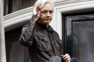 FILE - WikiLeaks founder Julian Assange greets supporters from a balcony of the Ecuadorian embassy in London, May 19, 2017. Britain’s top court on Monday March 14, 2022, refused WikiLeaks founder Julian Assange permission to appeal against a decision to extradite him to the U.S. to face spying charges. (AP Photo/Frank Augstein, File)