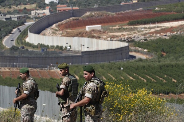 File - Lebanese army soldiers deploy at the Lebanese side of the Lebanese-Israeli border in the southern village of Kfar Kila, Lebanon, Saturday, May 15, 2021. (AP Photo/Hussein Malla, File)