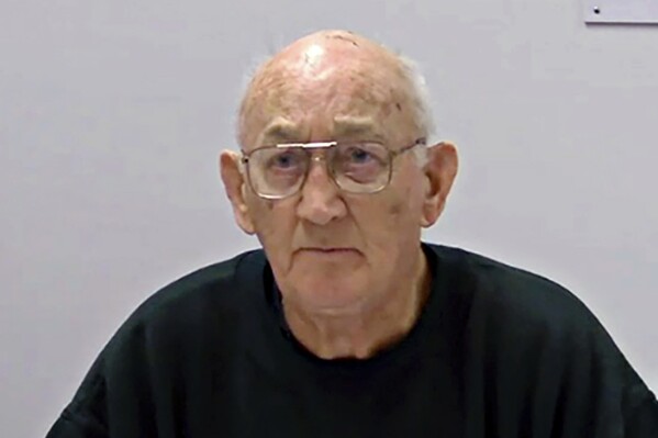 In this photo made from video on May 27, 2015, Gerald Ridsdale gives evidence during a child sex abuse royal commission. Ridsdale, an Australian ex-priest convicted of sexually abusing children, had another 12 months added to his 39-year prison sentence on Tuesday, Aug. 15, 2023, for molesting a 72nd victim. (Royal Commission/AAP Image via AP)