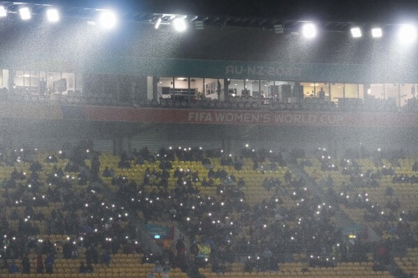 Rain pours down during the Women's World Cup Group G soccer match between Sweden and South Africa in Wellington, New Zealand, Sunday, July 23, 2023. (AP Photo/John Cowpland)