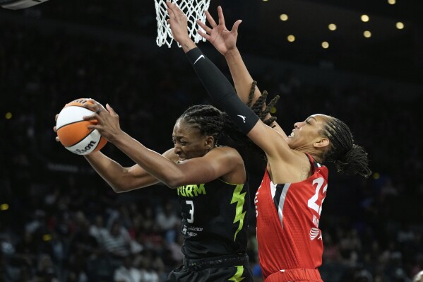 Seattle Storm forward Nneka Ogwumike (3) grabs a rebound against Las Vegas Aces center A'ja Wilson (22) during the second half of a WNBA basketball game Friday, June 20, 2025, in Las Vegas. (AP Photo/John Locher)