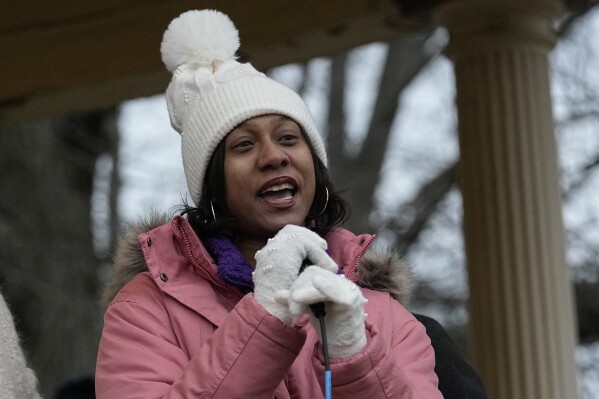 Brittany Watts, center, speaks to a rally of supporters, Thursday, Jan. 11, 2024, in Warren, Ohio. A grand jury on Thursday decided that Watts, who was facing criminal charges for her handling of a home miscarriage, will not be charged. (AP Photo/Sue Ogrocki)