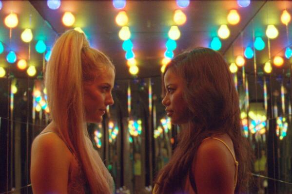This image released by A24 shows Riley Keough, left, and Taylour Paige in a scene from "Zola."  (Anna Kooris/A24 via AP)