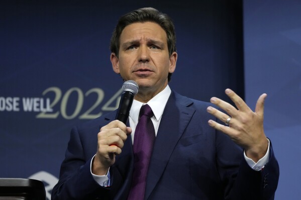 FILE - Republican presidential candidate Florida Gov. Ron DeSantis speaks during the Family Leadership Summit, July 14, 2023, in Des Moines, Iowa. Civil rights activists cheered when Ron DeSantis pardoned four Black men wrongfully convicted of rape as one of his first actions as Florida's governor. But four years later, as DeSantis eyes the presidency, their hope that the Republican would be an ally on racial justice has long faded. (AP Photo/Charlie Neibergall, File)