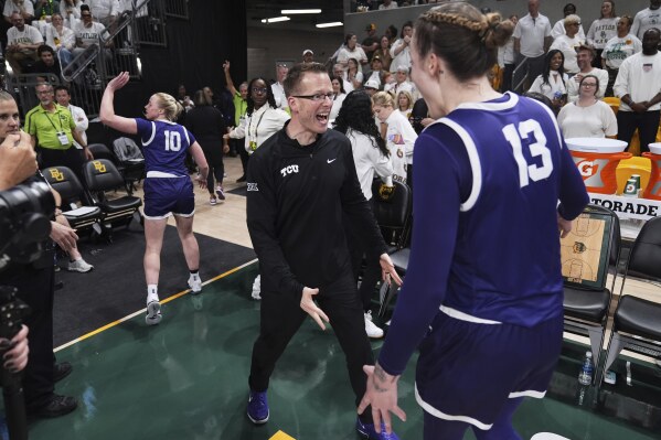 Hailey Van Lith (10), head basketball coach Mark Campbell, center, and Sedona Prince (13) celebrate their team's win against Baylor in an NCAA college basketball game in Waco, Texas, Sunday, March 2, 2025. (AP Photo/Tony Gutierrez)