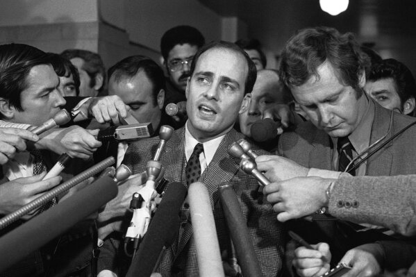 FILE - In this Jan. 26, 1971, file photo, Manson trial chief prosecutor Vincent Bugliosi talks with reporters outside a Los Angeles courtroom. Bugliosi was an ambitious but anonymous deputy district attorney when he was handed the Manson Family murder trial after a more experienced prosecutor was removed for mocking one of the defendants to reporters. He denounced Manson as the "dictatorial maharajah of a tribe of bootlicking slaves," calling Manson's followers "robots" and "zombies." After their convictions, he recounted the case in "Helter Skelter," one of history's best-selling true-crime books. He died of cancer at age 80 in 2015. (AP Photo, File)