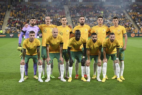 The Australian national soccer team, the Socceroos, pose for a photo before the start of a friendly soccer international between Australia and New Zealand in Brisbane, Australia, Thursday, Sept. 22, 2022. (AP Photo/Dan Peled)