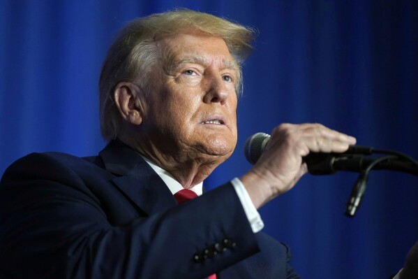 FILE - Former President Donald Trump speaks at the New Hampshire Federation of Republican Women Lilac Luncheon, June 27, 2023, in Concord, N.H. The 2024 election will determine whether Trump returns to the White House. It could also decide whether he might face time behind bars. (AP Photo/Steven Senne, File)