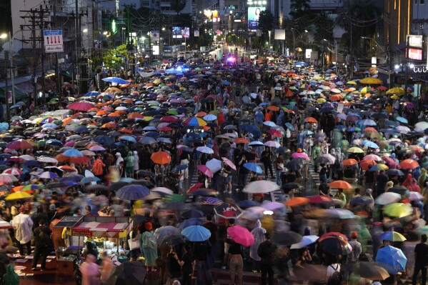 Supporters of the Move Forward Party walk in a circle during a protest in Bangkok, Thailand, Sunday, July 23, 2023. The demonstrators are protesting that Thailand's Constitution is undemocratic, because it allowed Parliament to block the winner of May's general election, the Move Forward Party, from naming its leader named the new prime minister, even though he had assembled an eight-part coalition that had won a clear majority of seats in the House of Representatives. (AP Photo/Sakchai Lalit)