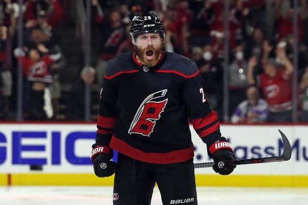 Carolina Hurricanes' Ian Cole (28) celebrates his overtime goal against the New York Rangers in Game 1 of an NHL hockey Stanley Cup second-round playoff series in Raleigh, N.C., Wednesday, May 18, 2022. (AP Photo/Karl B DeBlaker)