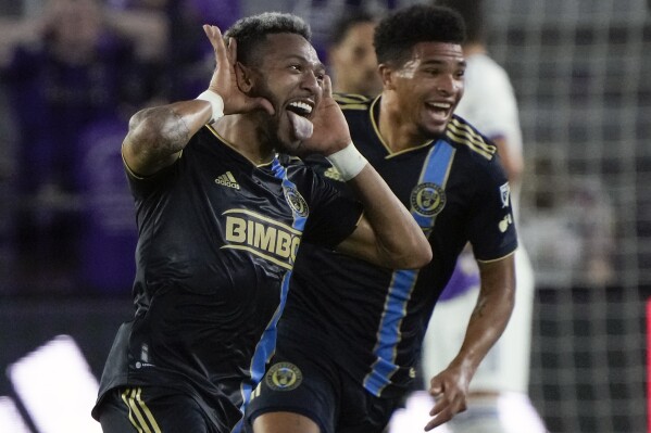 Philadelphia Union's Jose Andres Martinez, left, celebrates with Nahan Harriel, right, after scoring a goal against Orlando City during the second half of an MLS soccer match Wednesday, June 21, 2023, in Orlando, Fla. (AP Photo/John Raoux)