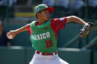 Mexico's David Zarate delivers during the second inning of a baseball game against Curacao, at the Little League World Series in South Williamsport, Pa., Thursday, Aug. 25, 2022. (AP Photo/Gene J. Puskar)