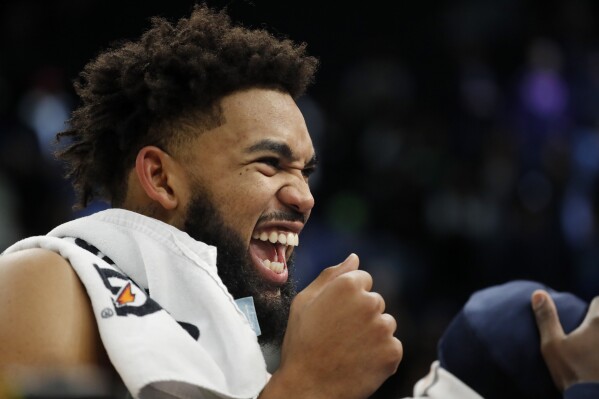 Minnesota Timberwolves forward Karl-Anthony Towns celebrates after a win over the Indiana Pacers in an NBA basketball game Saturday, Dec. 16, 2023, in Minneapolis. (AP Photo/Bruce Kluckhohn)