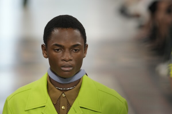 A model wears a creation as part of the Gucci men's Spring Summer 2025 collection, that was presented in Milan, Italy, Monday, June 17, 2024. (AP Photo/Luca Bruno)
