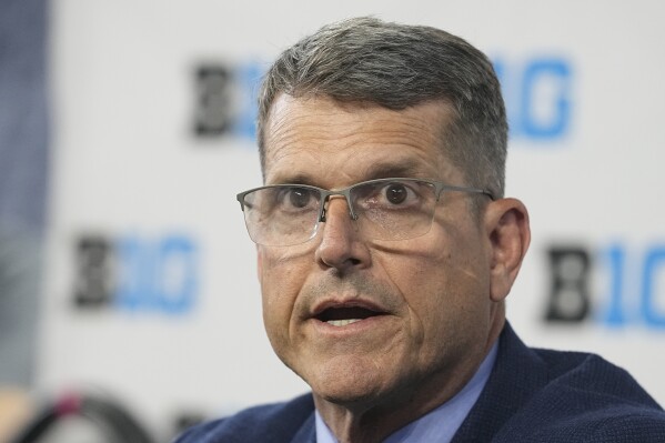 Michigan head coach Jim Harbaugh speaks during an NCAA college football news conference at the Big Ten Conference media days at Lucas Oil Stadium, Thursday, July 27, 2023, in Indianapolis. (AP Photo/Darron Cummings)