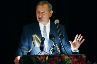 
              FILE - In this Sept. 27, 2017 file photo, Chief Justice John Roberts speaks during the Bicentennial of Mississippi's Judiciary and Legal Profession Banquet in Jackson, Miss. Roberts is pushing back against President Donald Trump’s description of a judge who ruled against the administration’s new asylum policy as an “Obama judge.” It’s the first time that the leader of the federal judiciary has offered even a hint of criticism of Trump, who has previously blasted federal judges who ruled against him.  Roberts says Wednesday that the U.S. doesn’t have ”Obama judges or Trump judges, Bush judges or Clinton judges.” He is commenting in a statement released by the Supreme Court after a query by The Associated Press. (AP Photo/Rogelio V. Solis)
            