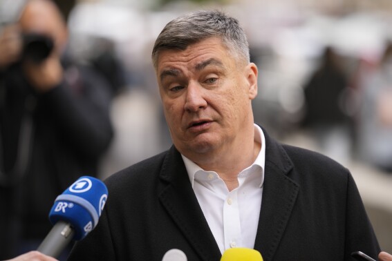 Croatia's President Zoran Milanovic addresses the media outside a polling station after casting his vote in Zagreb, Croatia, Wednesday, April 17, 2024. Croatia is voting in a parliamentary election after a campaign that centred on a bitter rivalry between the president and prime minister of the small European Union and NATO member. (AP Photo/Darko Bandic)