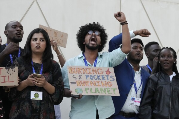 Activists participate in a demonstration at the COP28 U.N. Climate Summit, Friday, Dec. 8, 2023, in Dubai, United Arab Emirates. (APPhoto/Peter Dejong)