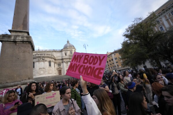 FILE - People stage a protest on 'International Safe Abortion Day' to ask for more guarantees on the enforcement of the abortion law that they claim is seriously endangered by the high rate of doctors' conscientious objection in the country, in Rome, Wednesday, Sept. 28, 2022. Premier Giorgia Meloni’s far-right-led government wants to allow anti-abortion groups access to women considering interrupting their pregnancies, making abortion a flashpoint argument in Italy 46 years after it was legalized in the overwhelmingly Catholic country. The Senate on Tuesday, April 23, 2024, was voting on procedural legislation tied to EU COVID-19 recovery funds that includes an amendment sponsored by Meloni’s Brothers of Italy party. (AP Photo/Alessandra Tarantino, file)