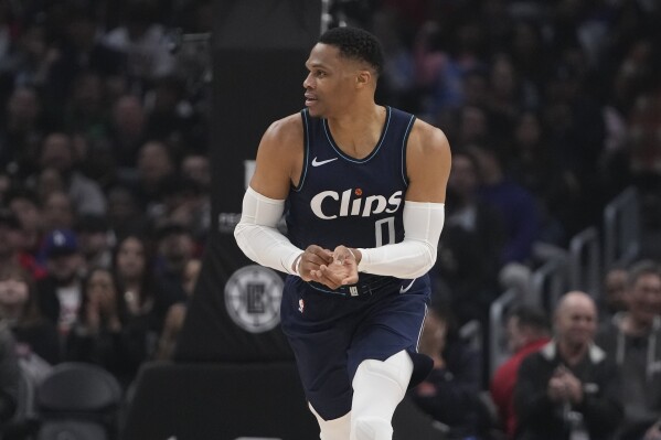 Los Angeles Clippers guard Russell Westbrook runs up the court during the first half of the team's NBA basketball game against the Washington Wizards, Friday, March 1, 2024, in Los Angeles. Westbrook fractured his left hand during the first half. (APPhoto/Ryan Sun)