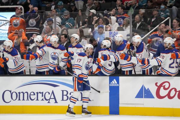 Edmonton Oilers center Connor McDavid (97) is congratulated after scoring against the San Jose Sharks during the first period of an NHL hockey game in San Jose, Calif., Friday, Jan. 13, 2023. (AP Photo/Godofredo A. Vásquez)