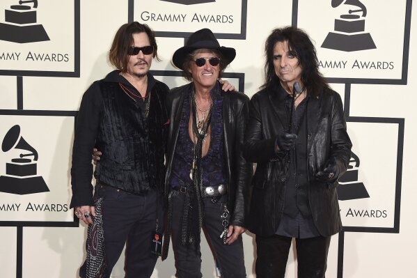 FILE - In this Feb. 15, 2016 file photo, from left to right, Johnny Depp, Joe Perry, and Alice Cooper of The Hollywood Vampires arrive at the 58th annual Grammy Awards at the Staples Center in Los Angeles. The group's sophomore album "Rise" comes out Friday, June 21, 2019.   (Photo by Jordan Strauss/Invision/AP, File)