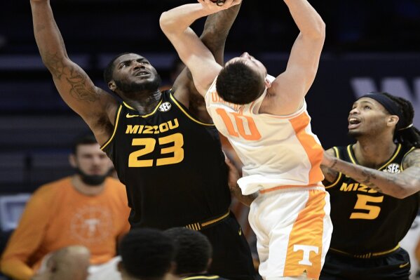 Missouri forward Jeremiah Tilmon (23) defends against Tennessee forward John Fulkerson (10) during an NCAA college basketball game Saturday, Jan. 23, 2021, in Knoxville, Tenn. (Calvin Mattheis/Knoxville New-Sentinel via AP, pool)