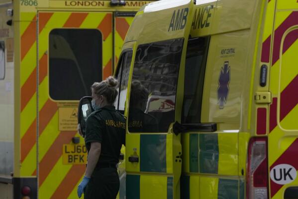 FILE - Ambulances wait outside the Royal London Hospital in east London, Wednesday, Jan. 4, 2023. British Prime Minister Rishi Sunak gathered government ministers, medics and health service managers in 10 Downing St. on Saturday, Jan. 7, 2023 for talks aimed at fixing a health care crisis that has seen thousands of patients stranded outside overflowing hospitals. (AP Photo/Alastair Grant, File)