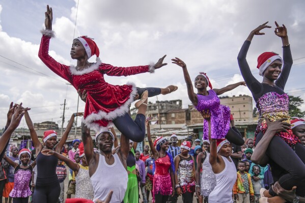 Young dancers perform, during a Christmas ballet event in Kibera slum, one of the busiest neighborhoods of Kenya's capital, Nairobi, Kenya Saturday, Dec. 21, 2024. (AP Photo/Brian Inganga)