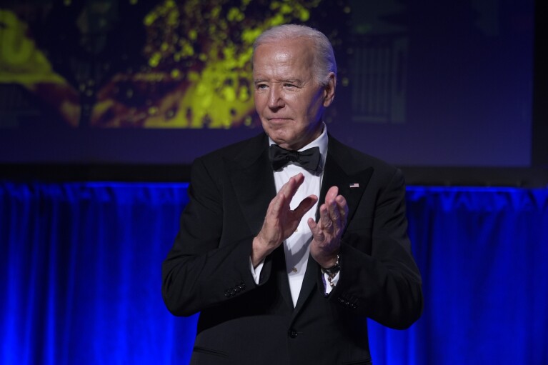 President Joe Biden applauds at the conclusion of the White House Correspondents' Association Dinner at the Washington Hilton, Saturday, April 27, 2024, in Washington. (AP Photo/Manuel Balce Ceneta)