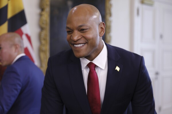 FILE - Maryland Gov. Wes Moore smiles during a news conference, Dec. 13, 2023, in Annapolis, Md. On Monday, Jan. 8, 2024, Moore announced a starting point for addressing the use of artificial intelligence in state government, as well as efforts to bolster cybersecurity. (APPhoto/Brian Witte, File)