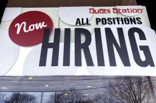 File - A hiring sign is displayed at a restaurant in Rolling Meadows, Ill., Tuesday, Dec. 27, 2022. On Thursday, the Labor Department reports on the number of people who applied for unemployment benefits last week. (AP Photo/Nam Y. Huh, File)