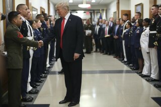 
              President Donald Trump greets military personnel during his visit to the Pentagon, Thursday, July 20, 2017. (AP Photo/Pablo Martinez Monsivais)
            
