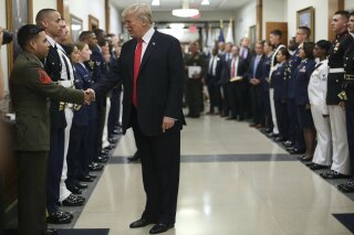 President Donald Trump greets military personnel during his visit to the Pentagon, Thursday, July 20, 2017. (AP Photo/Pablo Martinez Monsivais)
