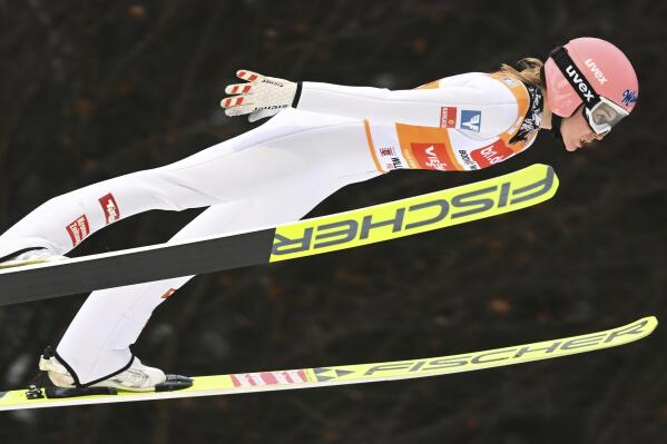 Marita Kramer from Austria jumps from the Muhlenkopf hill in the first competition round during the women's large hill, ski jumping World Cup, in Willingen, Germany, Saturday Jan. 29. 2022. (Arne Dedert/dpa via AP)