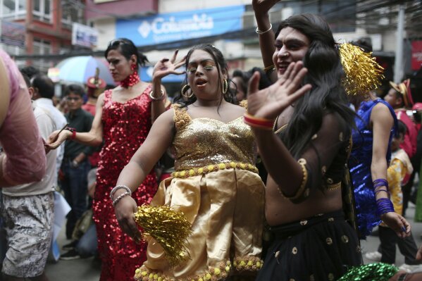 In this Aug. 16, 2019, photo, participants dance at a gay pride parade in Kathmandu, Nepal. Nepal seized the lead in equal rights for sexual minorities in South Asia four years ago with a new constitution that forbids all discrimination based on sexual orientation. But activists say progress in equal rights has stalled since the constitution was adopted. (AP Photo/Niranjan Shrestha)
