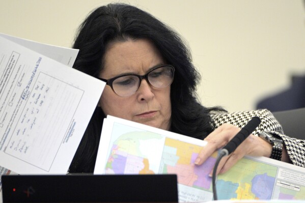 FILE - State Sen. Kelli Stargel looks through redistricting maps during a Senate Committee on Reapportionment hearing on Jan. 13, 2022, in Tallahassee, Fla. A Florida redistricting plan pushed by Gov. Ron DeSantis violates the state constitution and is prohibited from being used for any future U.S. congressional elections since it diminishes the ability of Black voters in north Florida to pick a representative of their choice, a state judge ruled Saturday, Sept. 2, 2023. (AP Photo/Phelan M. Ebenhack, File)