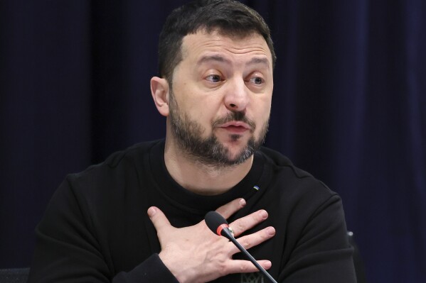 Ukrainian President Volodymyr Zelenskyy gestures during a meeting with U.S. Vice President Kamala Harris at the Munich Security Conference at the Bayerischer Hof Hotel in Munich, Germany, Saturday, Feb. 17, 2024. The 60th Munich Security Conference (MSC) is taking place from Feb. 16 to Feb. 18, 2024. (Wolfgang Rattay/Pool Photo via AP)