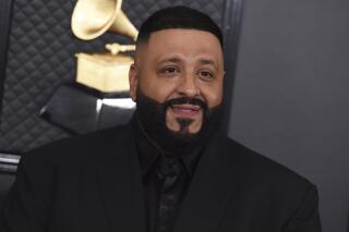 FILE - DJ Khaled arrives at the 62nd annual Grammy Awards on Jan. 26, 2020, in Los Angeles. DJ Khaled latest maximalist album, "Khaled Khaled," features a total of 29 rappers and singers across 13 tracks. (Photo by Jordan Strauss/Invision/AP, File)